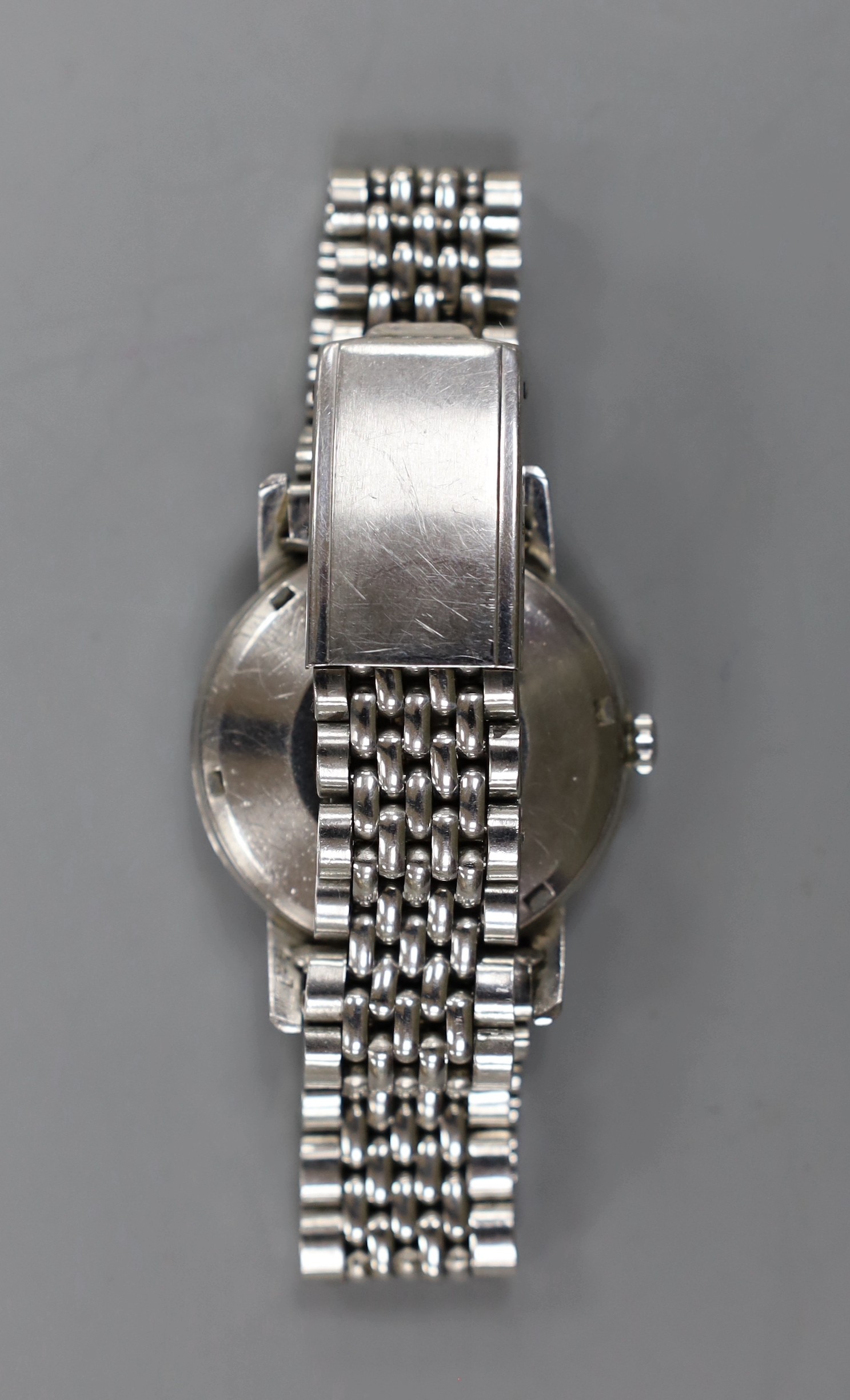 A gentleman's stainless steel Longines Conquest Automatic wrist watch, on associated bracelet.